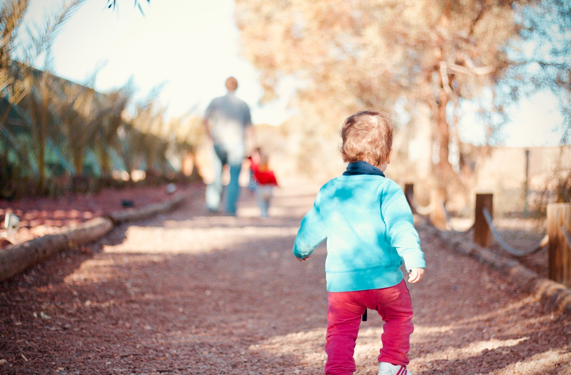 A toddler walking down a path representing advances in walking ability for children with cerebral palsy