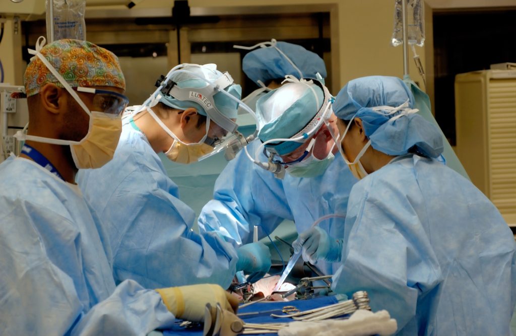 A surgical team performing an operation representing a situation in which a black box recorder could help reduce errors in the operating room